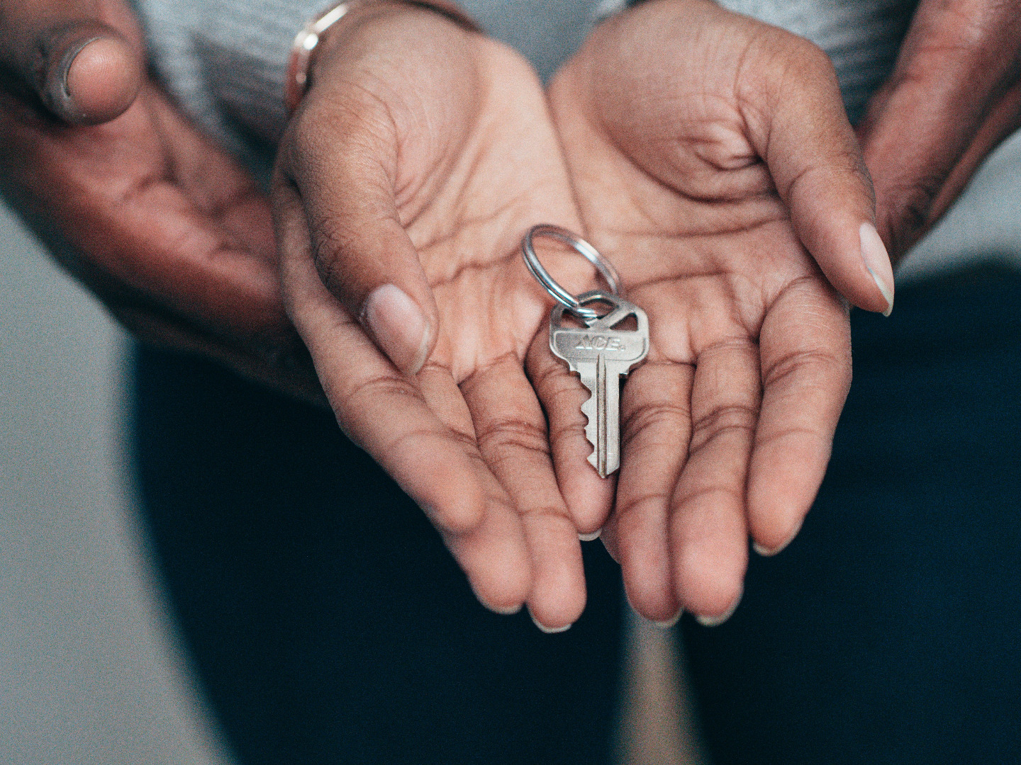 Woman hold key to new house